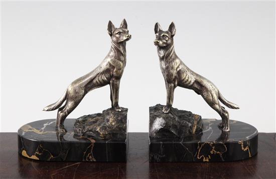 A pair of Art Deco silvered bronze bookends, modelled as hounds, 5in.